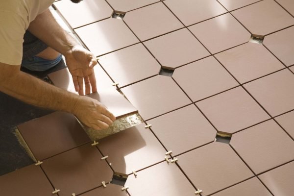 Installing-Ceramic-Floor-Tile-86464768-583ffd0d5f9b5851e5eac8c0